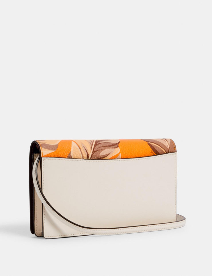 anna foldover crossbody clutch with banana leaves print