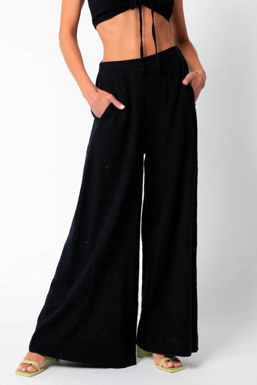 Olivaceous gauze palazzo pants in black