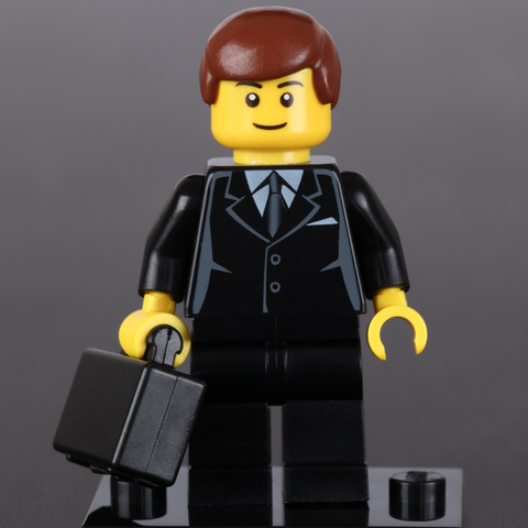 A lego man in a business suit
