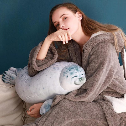 Cute Seal Stuffed Being Held by Woman