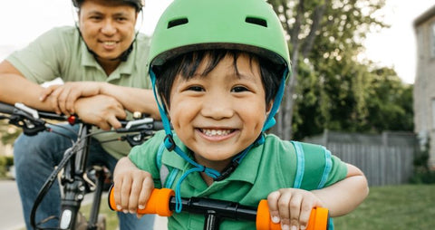Kids Wearing a Safety Helmet on a Bike