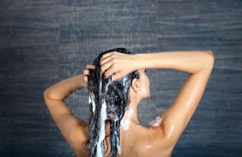 Woman Washing Hair Before Straightening It