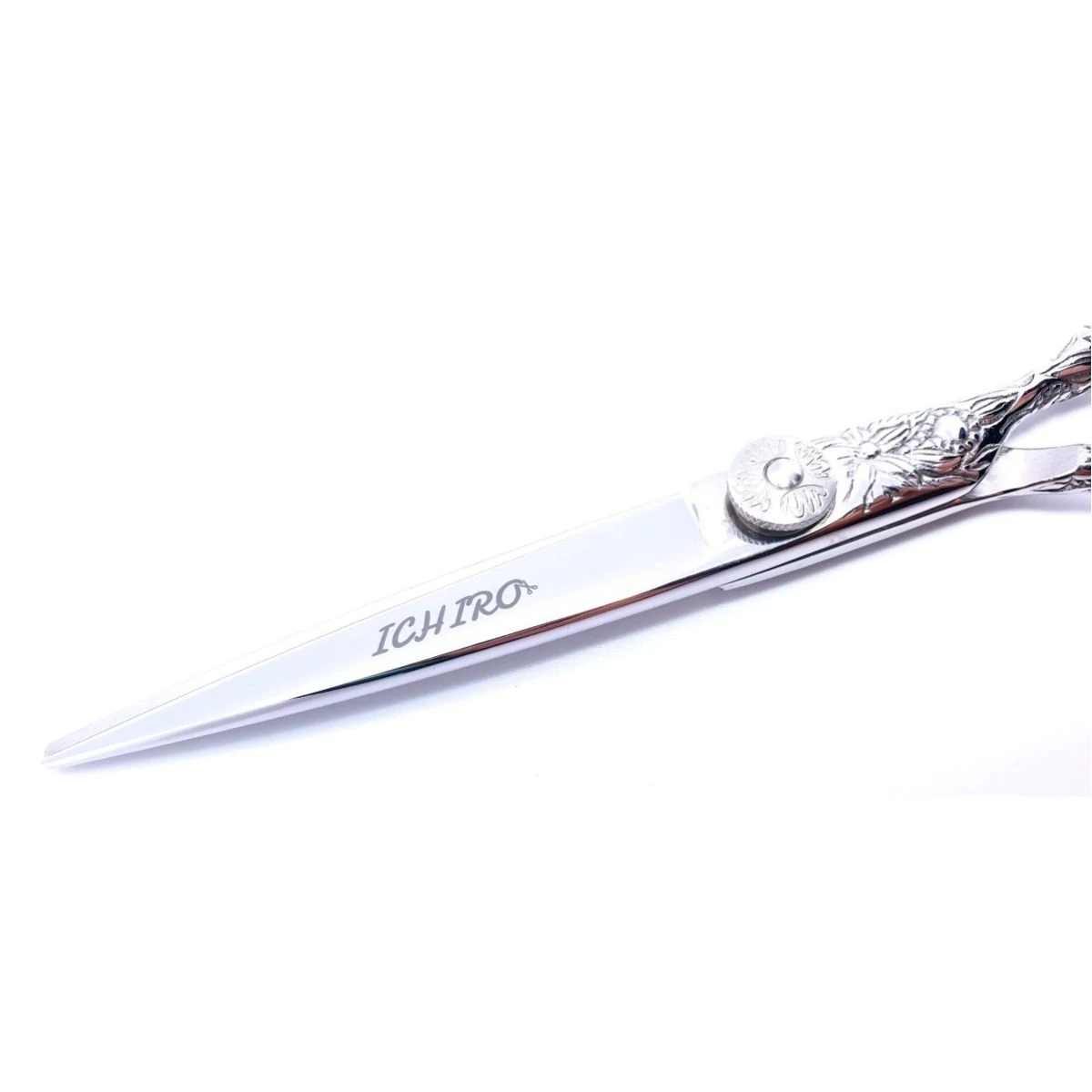 The Japanese 440C hairdressing shear with a handcrafted Sakura pattern on the body and handle