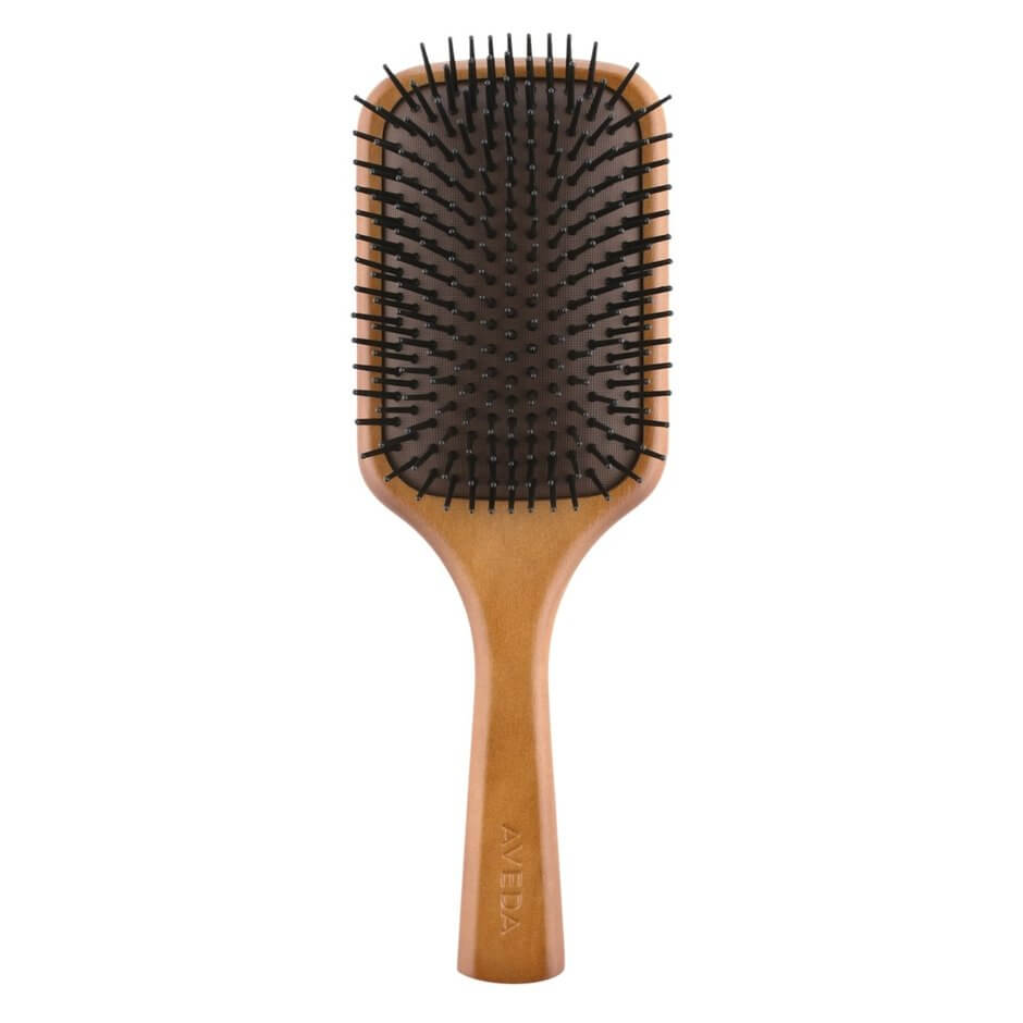 The paddle brush used by hairstylists