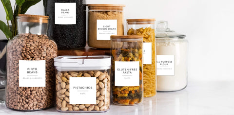 Pantry jars with pre-printed white minimalist pantry labels