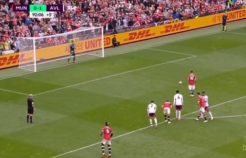 Bruno Fernandes about to take a penalty for Man United v Emi Martinez of Aston Villa 