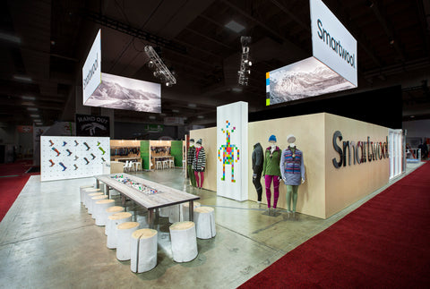 The Smartwool booth benefits from cross traffic at an intersection in the tradeshow walkways.