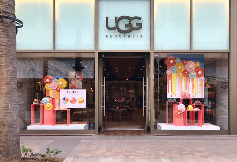 Ugg boots spring lineup in colorful window display.