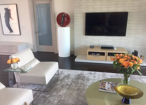 White cylinder pedestal in living room