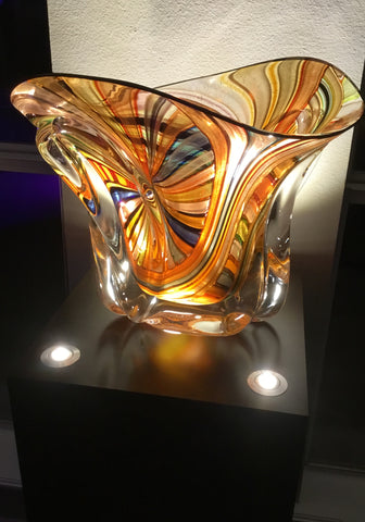 Glass bowl with corner lighted pedestal