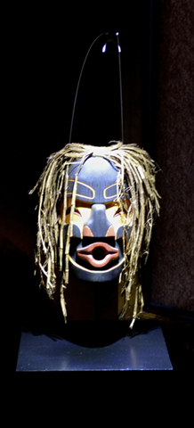 Klingit mask showcased with overhead light