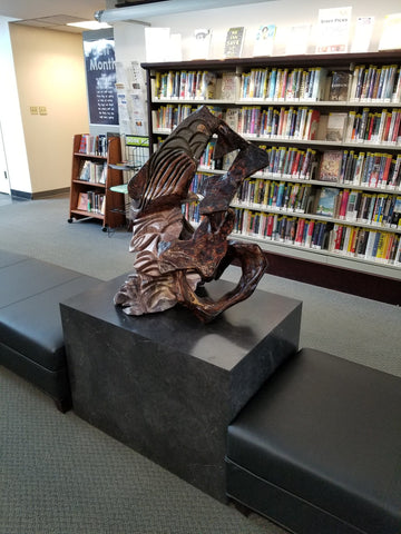 Sculpture display on cube table in public library