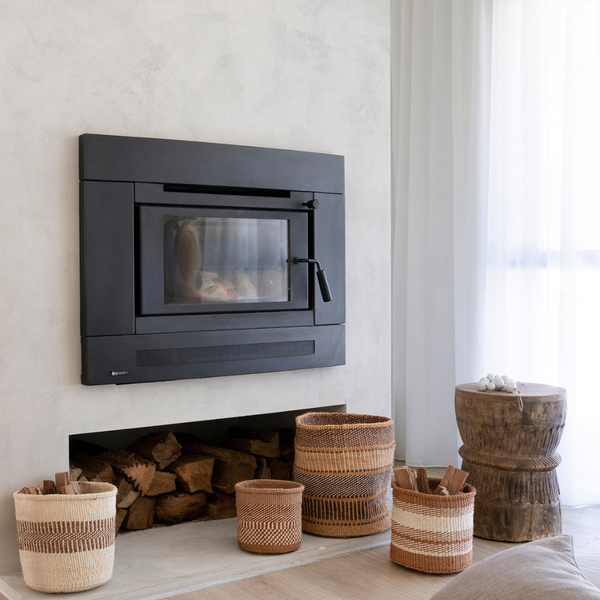 Woven baskets in front of fire place