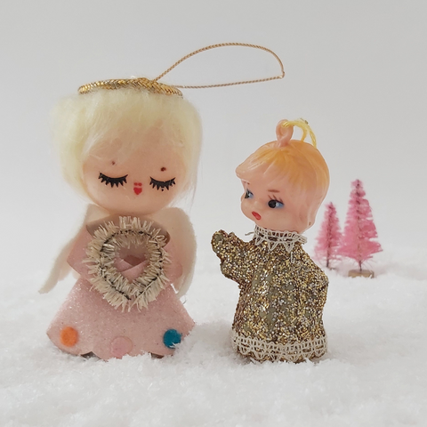 two mid century style angel ornaments, standing side by side