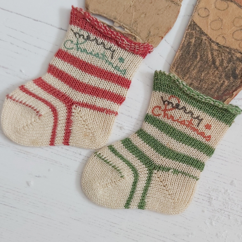 vintage Christmas socks on cardboard Santa