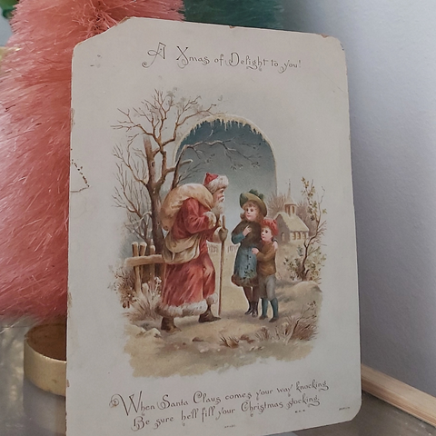 vintage Christmas postcard with Santa and children