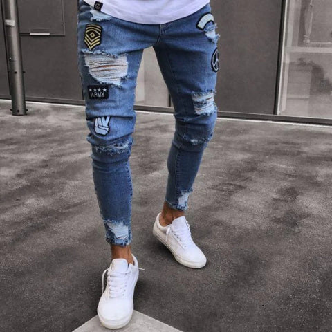 męskie jeansy z przetarciami