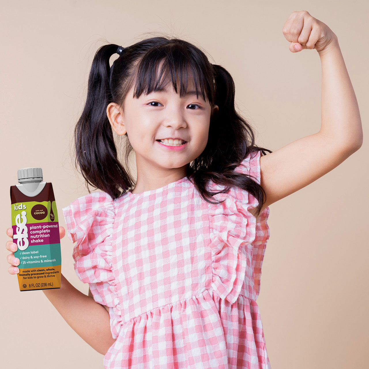 girls drinking kids protein shake