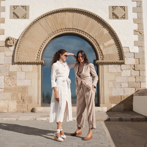 two women enjoying the mediterranean city in espadrille wedges
