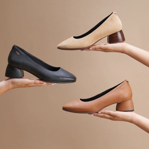 three woman's leather shoes in brown, black and camel colors