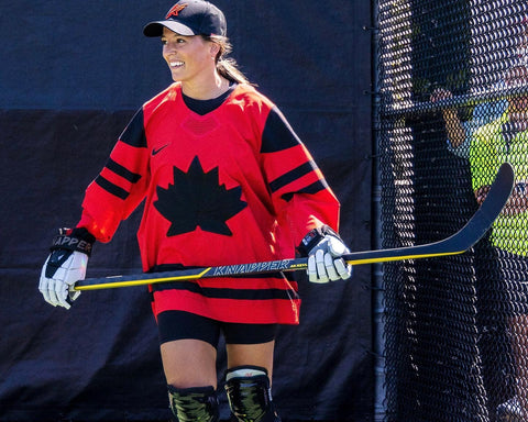 Women Street Hockey Player Holding a 100% Carbon Fiber Stick