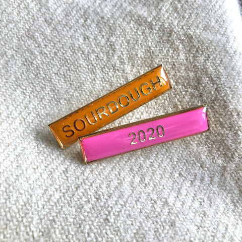 Cast brass and gold-plated enamel school lapel badges with "Sourdough" and "2020" 