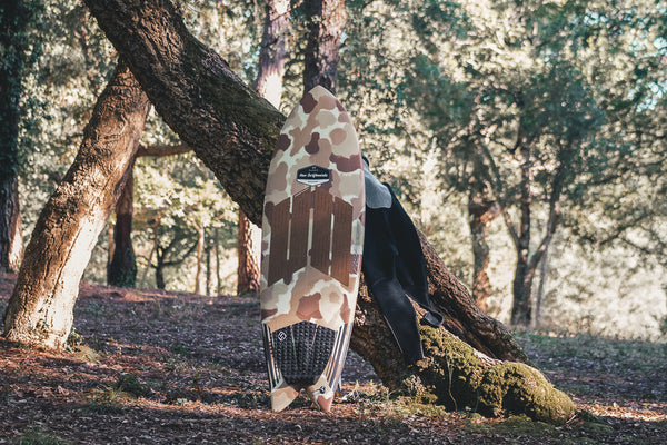 Hav Surfboards retrofish painted in camo in the woods