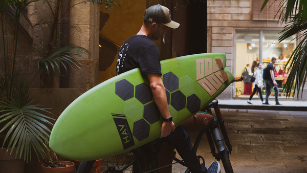 Carles Carrera, RSPro founder, with a fish surfboard