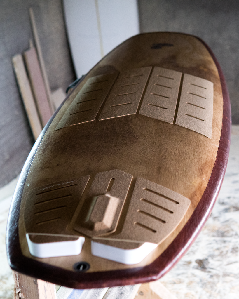 Flama Surfboard equipped with RSPro cork traction on the shapping room