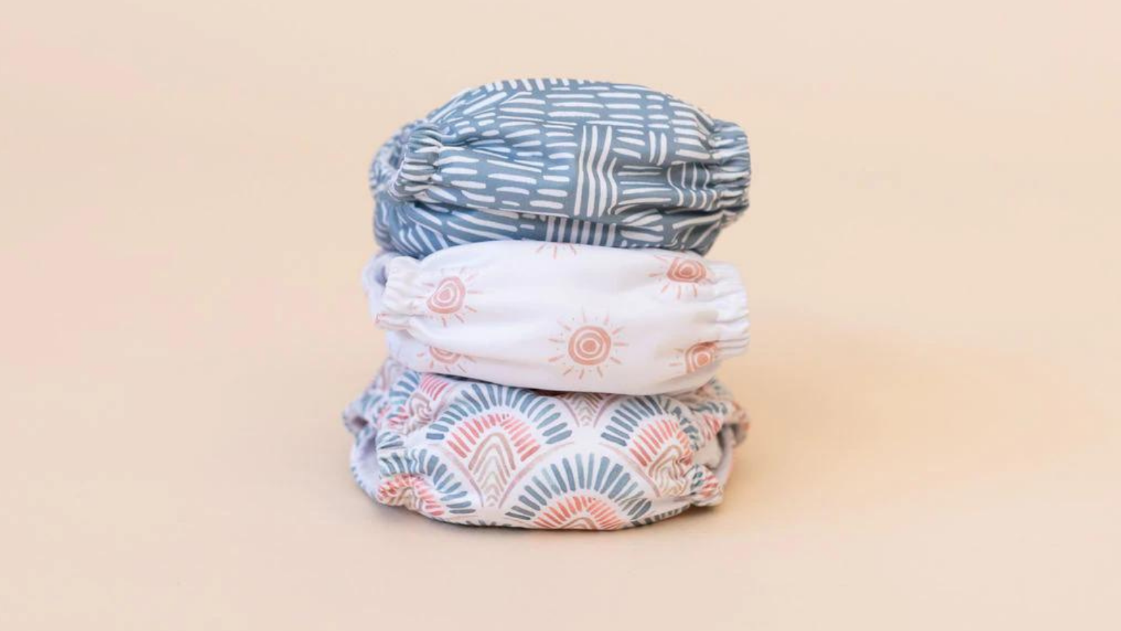 Image of a stack of the Bare and Boho Soft Cover Nappy Bundle in the Summer Days design
