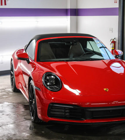 Image of a red Porsche to convey the best car meet ups - Sigma Kore