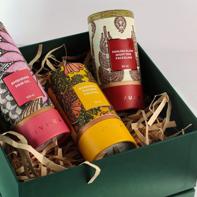 Manjish Glow Elixir and other iYURA products showing off their beautiful packaging with Madhubani painting