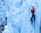Ice climbing on a wall of frozen ice