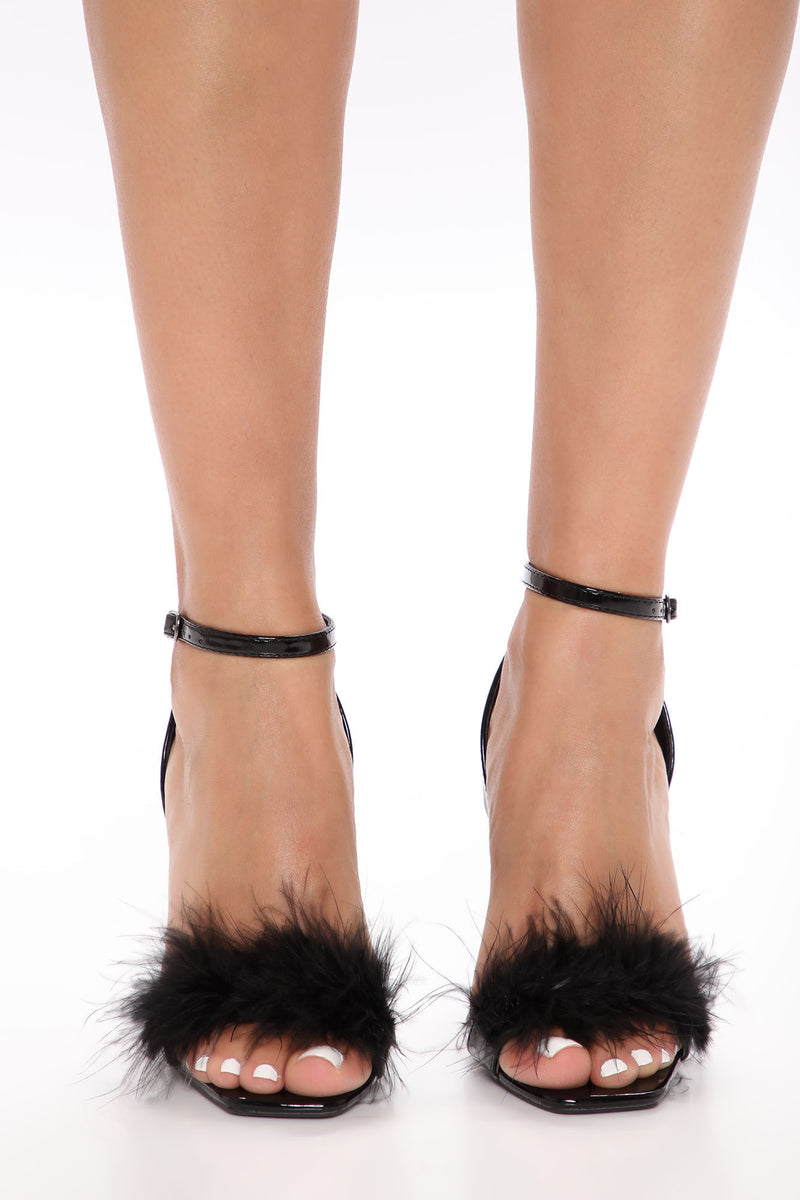heels with feathers on the back