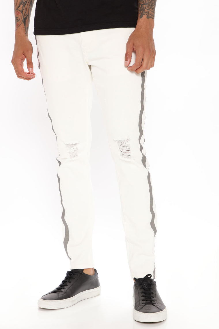white skinny jeans with black stripe down the side