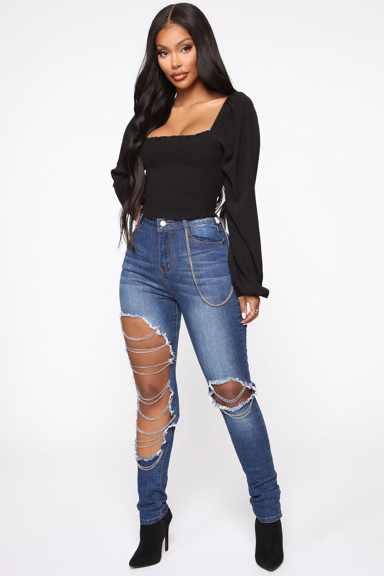 jeans with rips and chains
