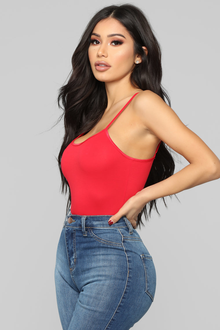 red bodysuit black jeans