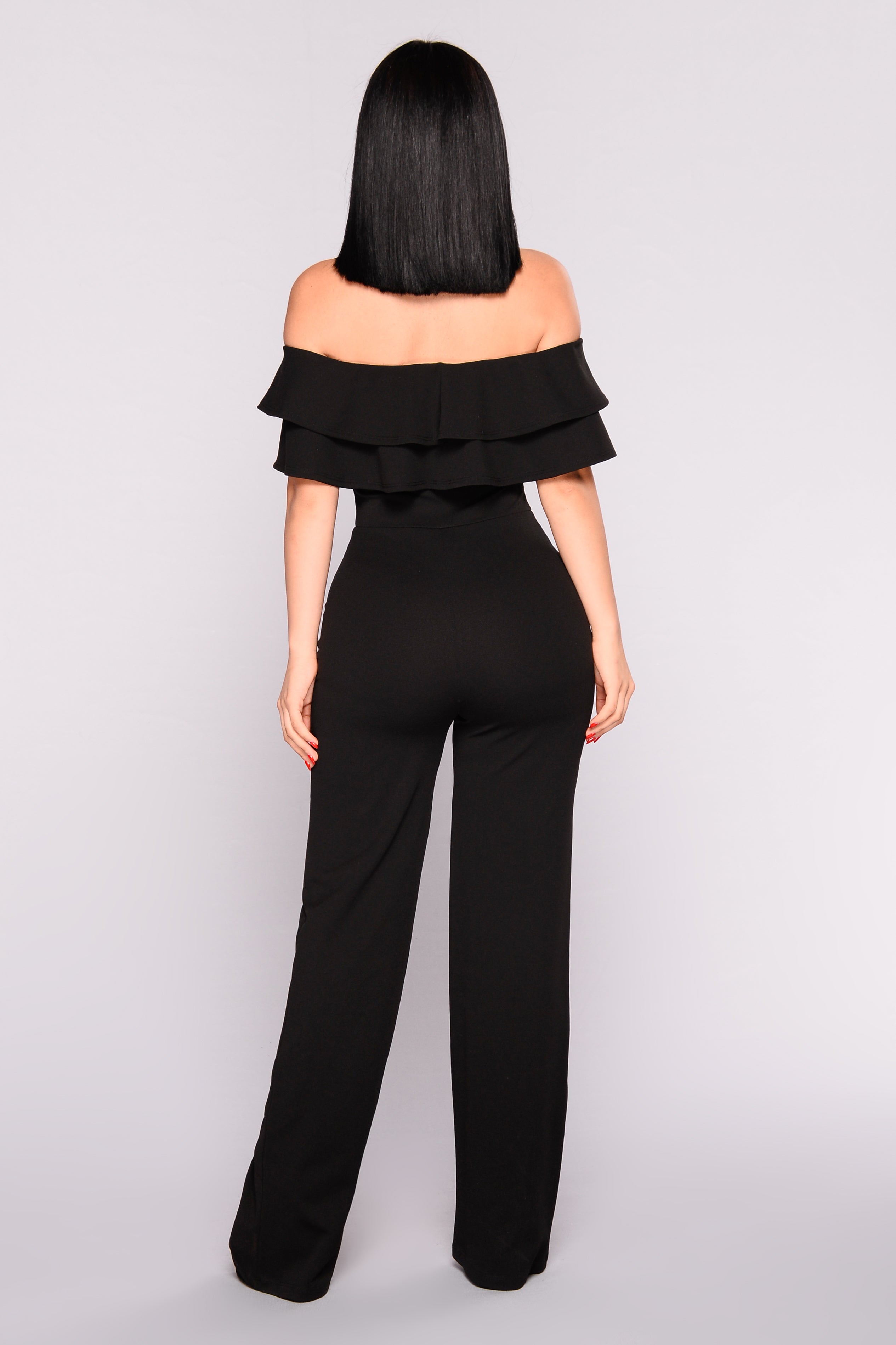 black jumpsuit with ruffles
