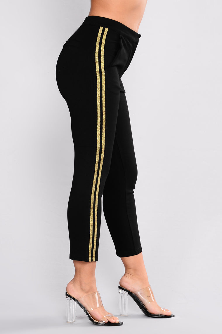 black pants with gold stripe