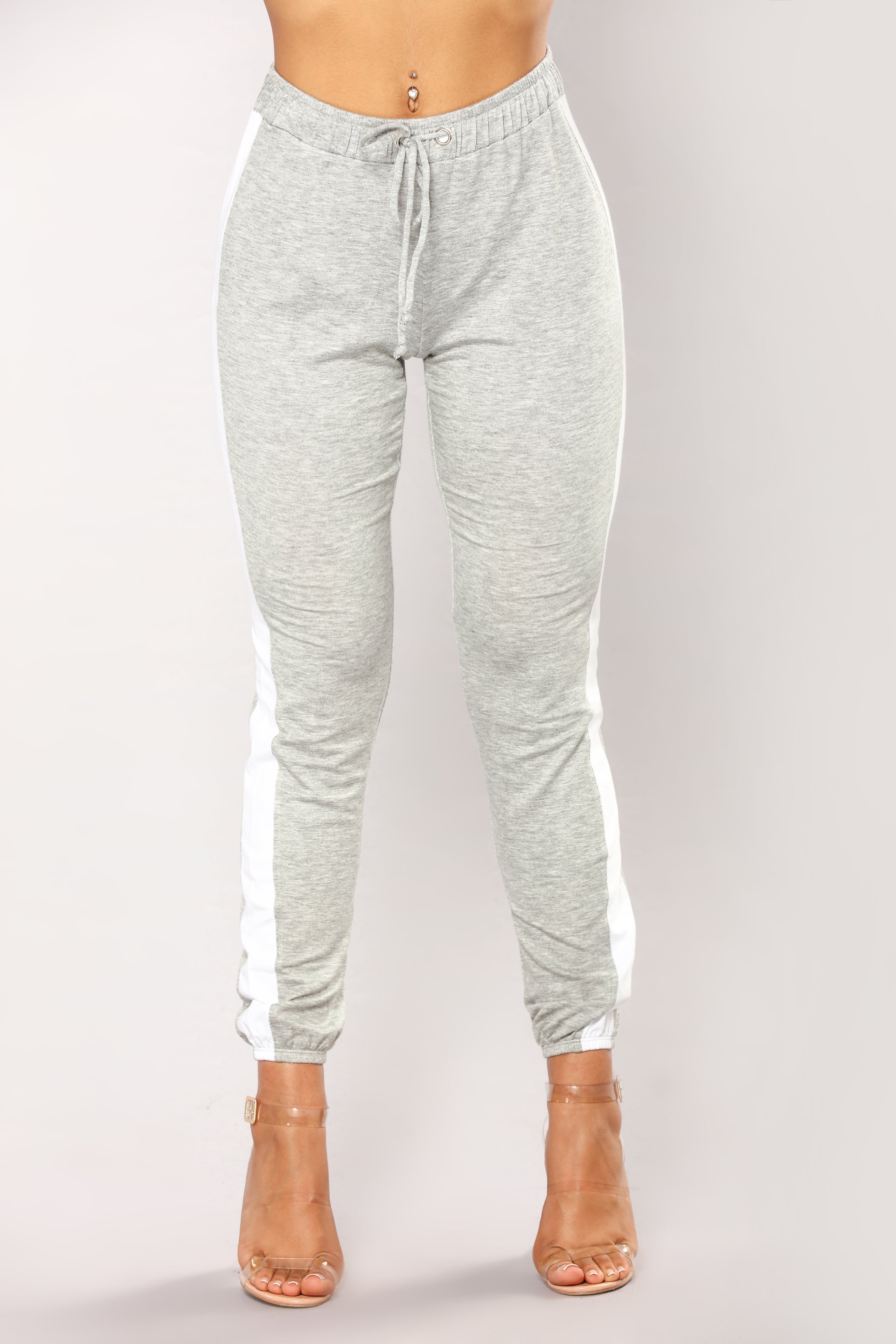 grey joggers with white stripe