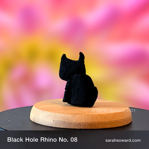 Black Hole Rhino sculpture number 08 on a bamboo stand