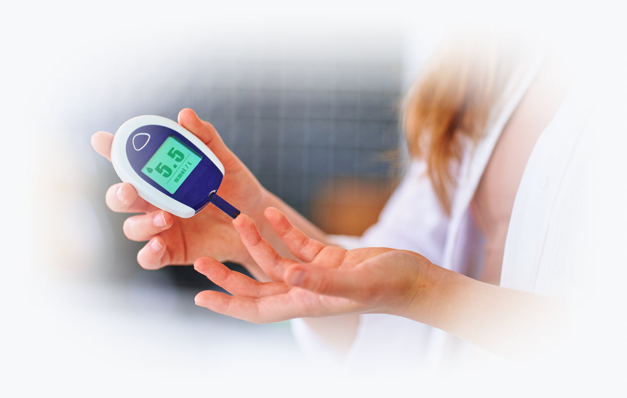 Image of woman getting sugar level tested with hand held device