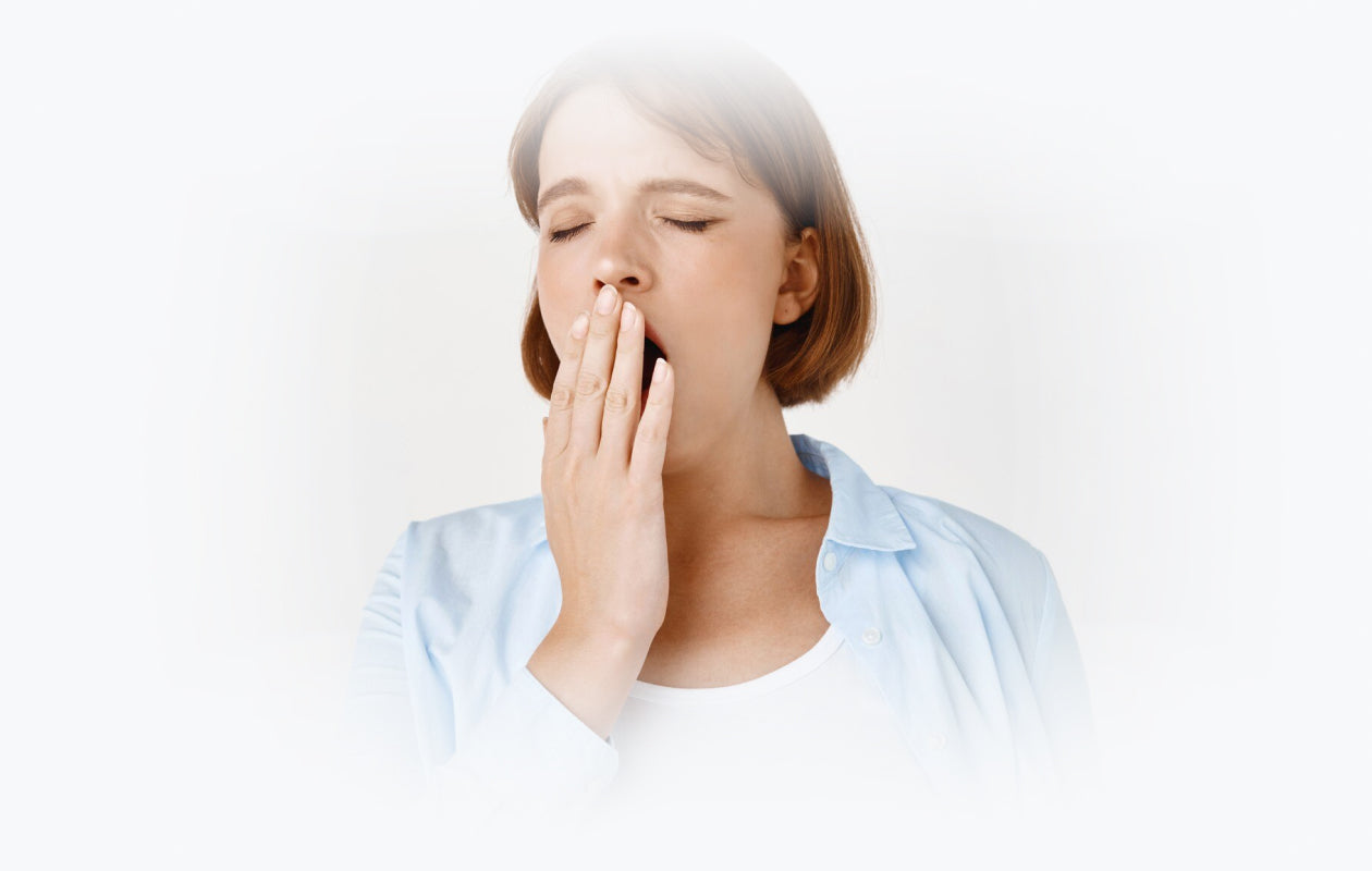 Photo of woman yawning because of CHRONIC FATIGUE