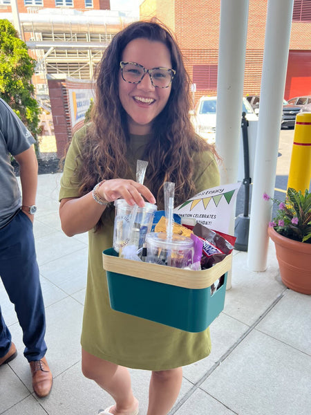 founder of courage in time Jillian with NICU care package gift