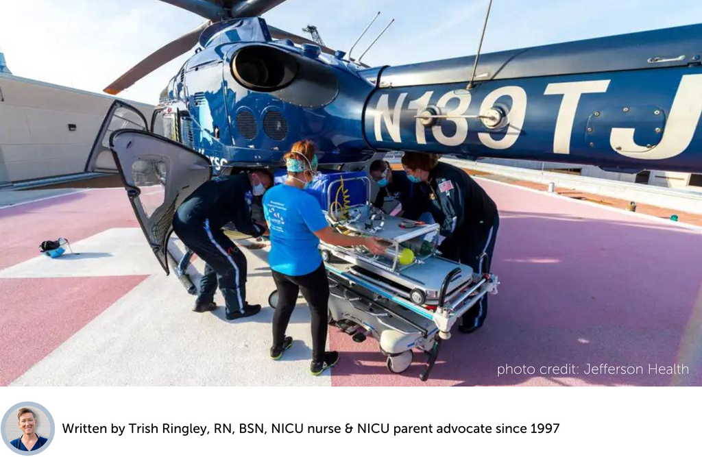 NICU neonatal transport team loading transport isolette into air ambulance medical helicopter for preemie transfer to new hospital
