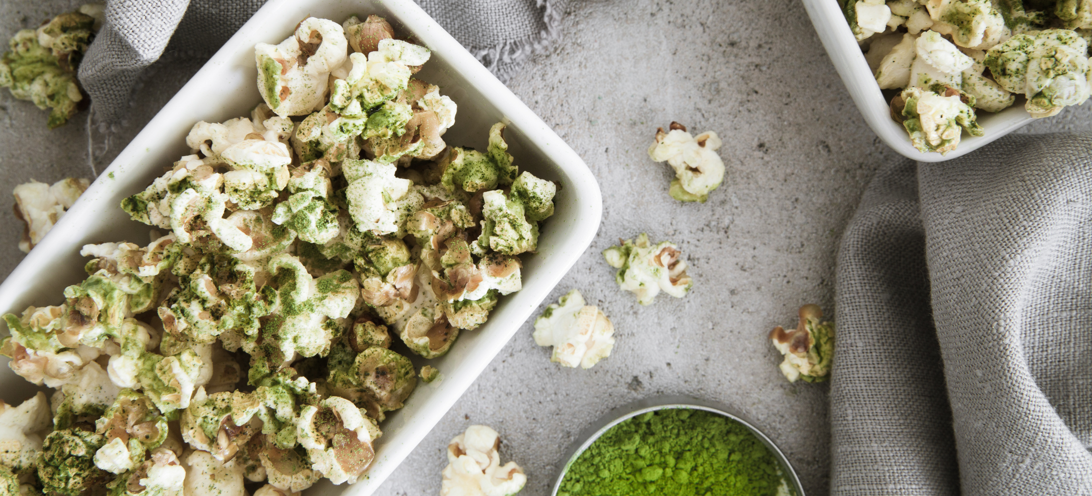 cuisipro recipe green matcha popcorn, image of popcorn sprinkled with powdered matcha