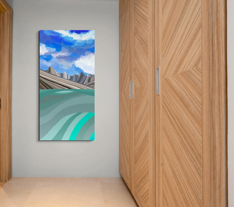 A minimalist hallway with light-colored walls, featuring a tall vertical painting of a stylized landscape with blue skies and mountain ranges, hanging between wooden patterned double doors. The name of the painting is Gates of he Arctic National Park by Topher Straus