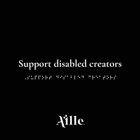 Black square with white text and simulated braille that read "Support disabled creators"