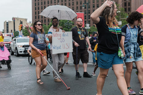 Parade goers with and without disabilities march down the Parkway in Philly. Image Credit: Disability Pride PA