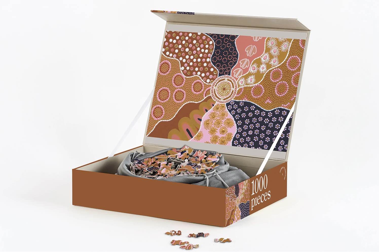 Desert Flower Puzzle featuring an Indigenous artwork in brown, orange, earthy tones